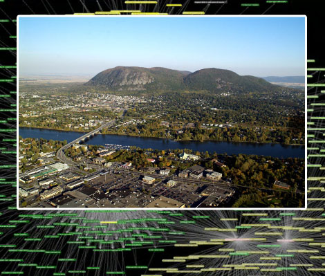 Aerial photo of the Mont Saint-Hilaire in front of a graphic representation of a trophic network